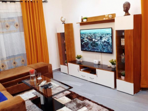 Appartement Cosy & Chill avec Groupe Electrogène, Forage, Parking, Gardien et WiFi